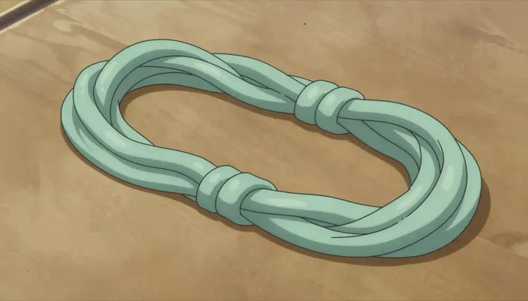 Visual representation of "skein" - A long piece of yarn or thread loosely knotted, wound up together, commonly used in crafting.