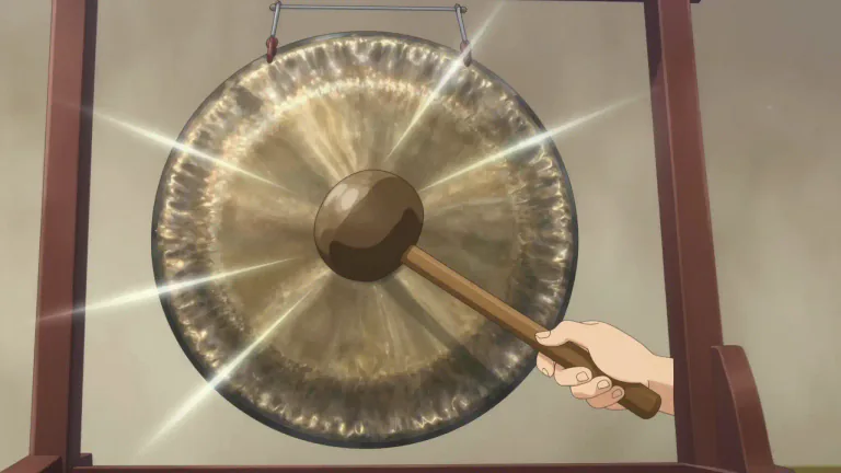 Visual representation of "gong" - A metallic disc that makes a loud noise when struck