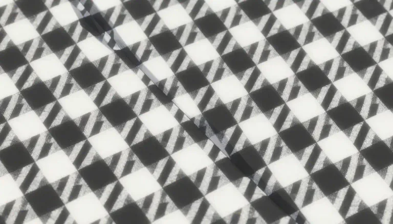 Visual representation of "houndstooth" - A distinct textile pattern composed of broken checks, typically in contrasting colors like black and white.