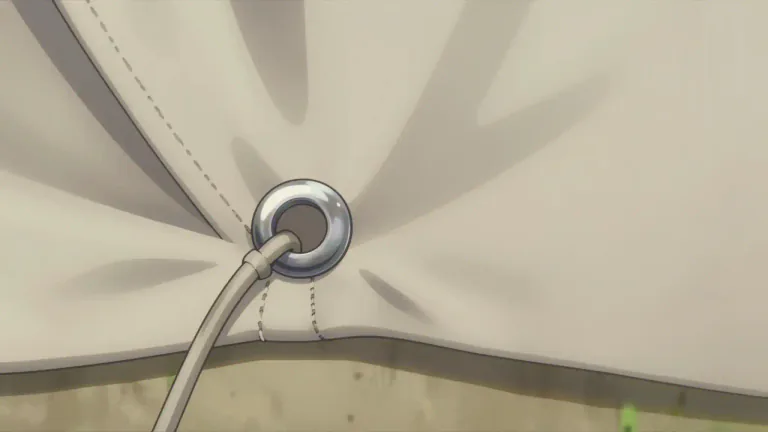 Visual representation of "grommet" - A metal or plastic ring used to strengthen an eyelet or hole in fabric or leather