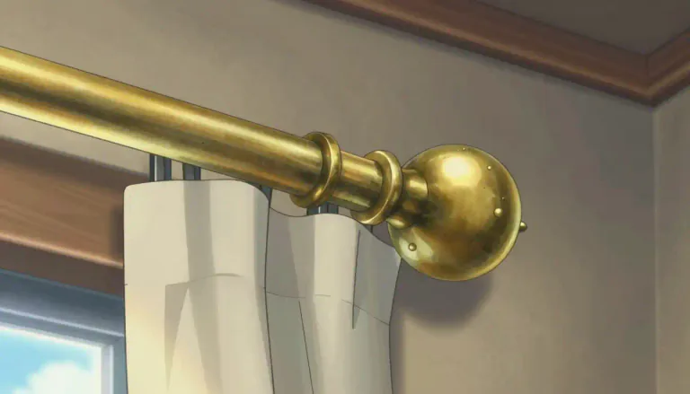 Visual representation of "finial" - A decorative piece, usually shaped like a ball or spike, at the top end of something long, such as a pole or a curtain rod