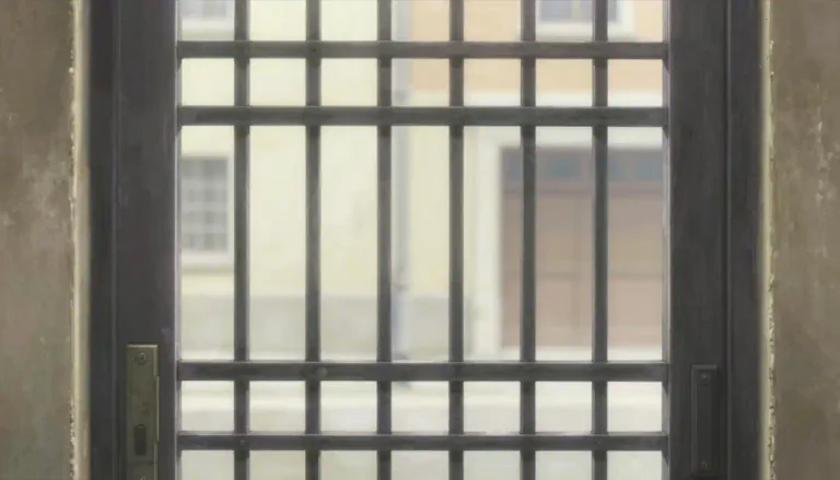 Visual representation of "grille" - A metal frame with bars across it, used as a cover for an opening