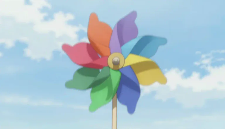Visual representation of "pinwheel" - A pinwheel is a toy made of a wheel of blades that spins around a center pin when the wind blows.