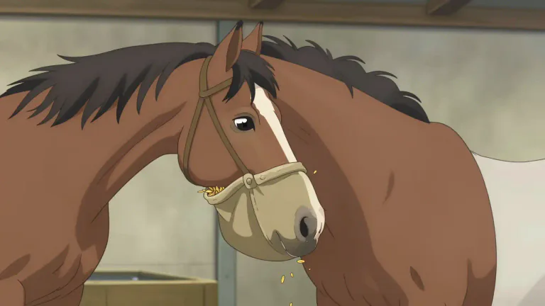 Visual representation of "nosebag" - A bag that is filled with food and attached to a horse's head for it to eat from.