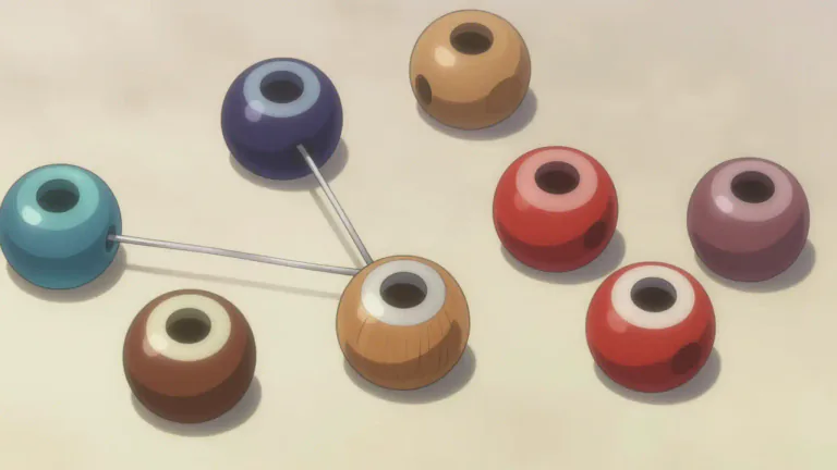 Visual representation of "bead" - A small piece of material, like glass, plastic or wood, with a hole in it for threading on string.