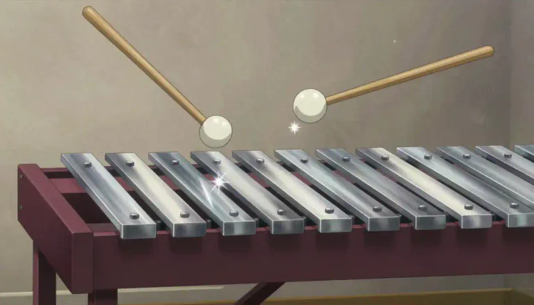 Visual representation of "glockenspiel" - A glockenspiel is a musical instrument that consists of a set of tuned metal bars that are struck with mallets to produce musical notes.