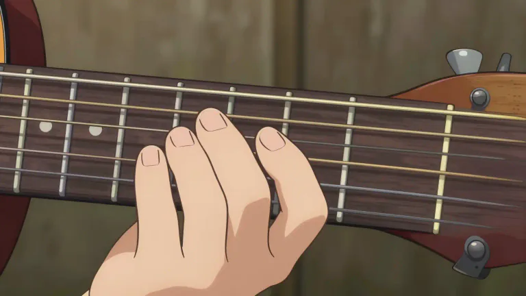 Visual representation of "fretboard" - The fretboard is the flat surface on the neck of a stringed instrument where the strings are pressed to produce musical notes.