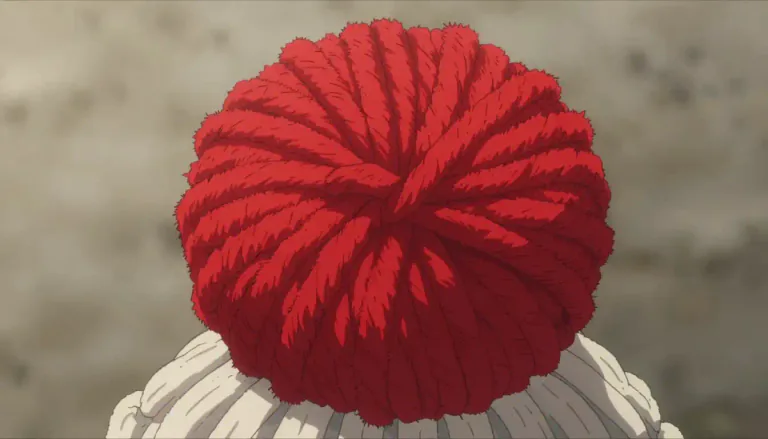 Visual representation of "pompon" - A decorative ball or tuft of material, often made of yarn or fabric, used in various crafts or as an embellishment.