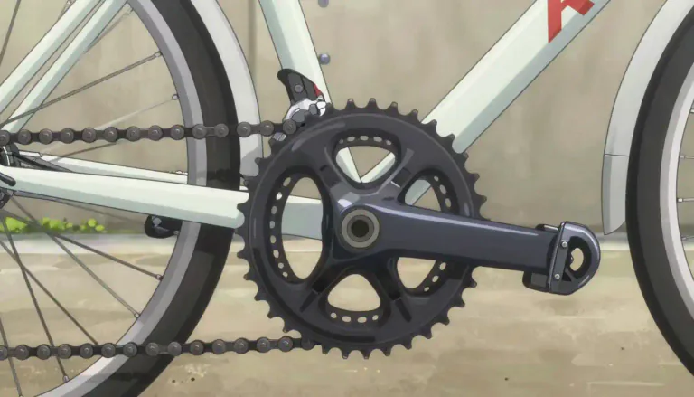 Visual representation of "chainring" - A circular part of a bicycle crankset that the chain rides on to transfer power from the pedals to the rear wheel.