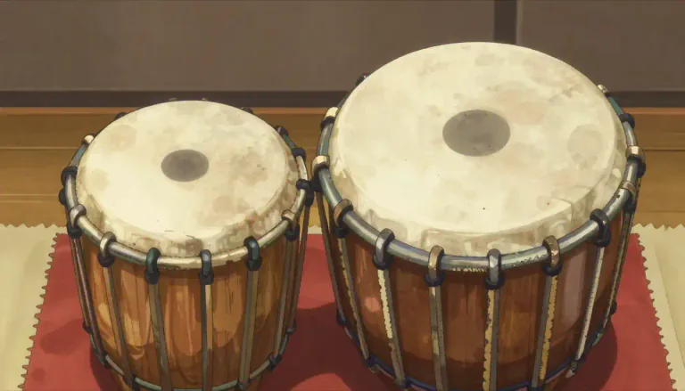 Visual representation of "tabla" - A tabla is a pair of hand-played drums that are integral to Indian classical music, consisting of a smaller drum called the 'dayan' and a larger one called the 'bayan'.