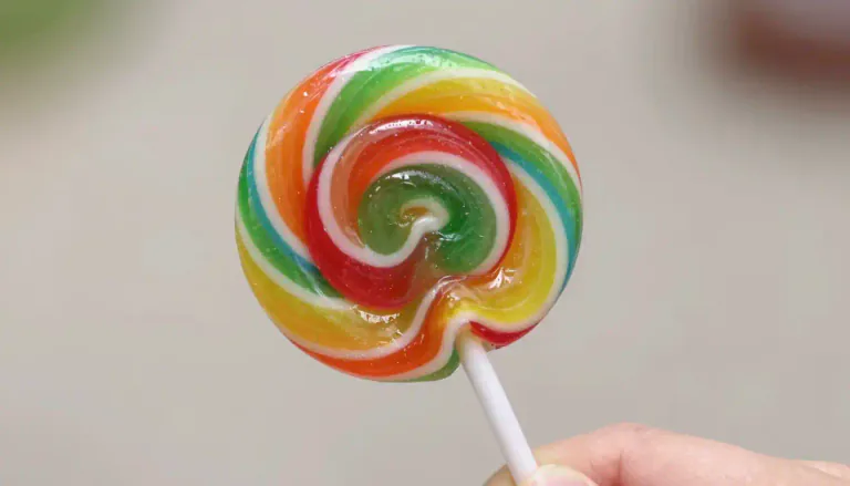 Visual representation of "lollypop" - A sweet food made of hard candy mounted on a stick.