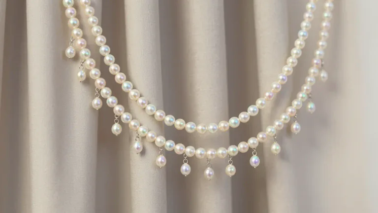 Visual representation of "beading" - Small decorative balls or pearls strung together and used for decoration.