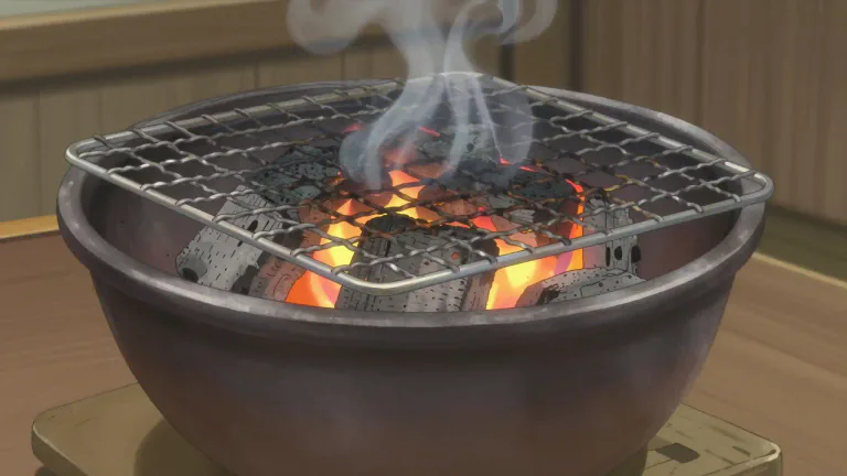 Visual representation of "hibachi" - A hibachi is a traditional Japanese grill consisting of a box or bowl made of metal or ceramics, used for cooking over charcoal or wood fire.