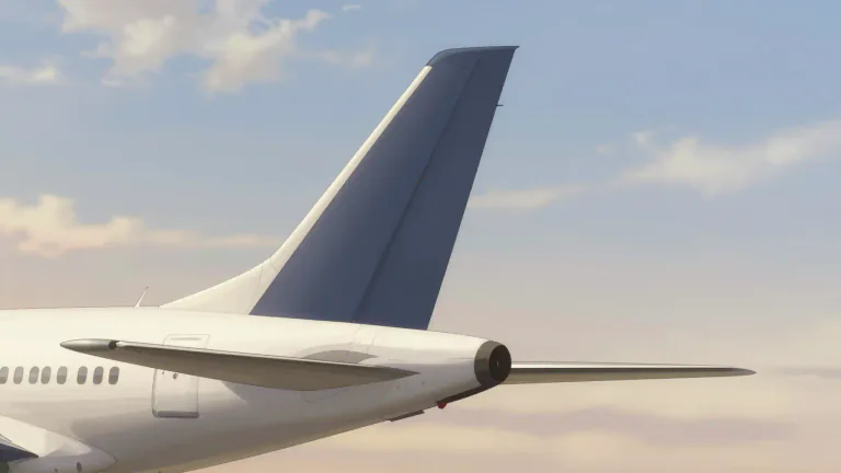 Visual representation of "tailfin" - A vertical fin located at the back of an aircraft or fish that helps stabilize and control its movement.