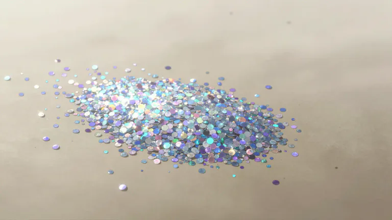 Visual representation of "glitter" - Tiny shining pieces often used for decoration