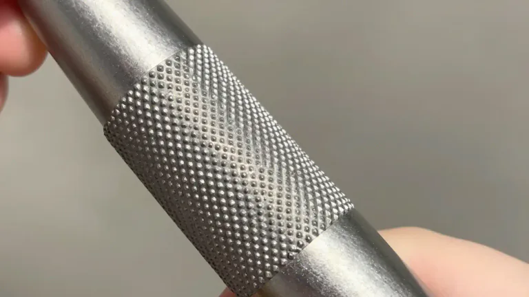 Visual representation of "knurled" - Having a series of small raised ridges or bumps, typically to facilitate a better grip.
